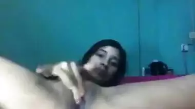 Desi female lies on back and wildly masturbates her XXX cherry on camera