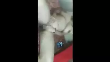 Indian guy records porn clip in which he starts fucking busty wife