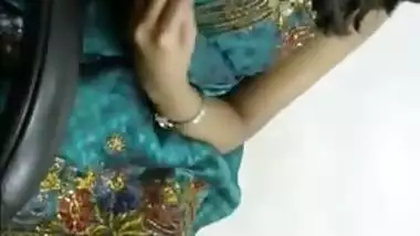 Solo Indian babe in a luxurious dress is excited so she touches tits