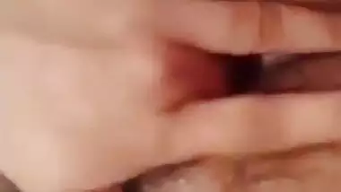 Indian girl nude MMS of a girl fingering her hairy pussy