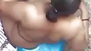 Spy XXX video of village aunty taking bath in outdoor taken by her lewd neighbor